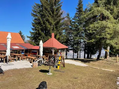 a park with a playground and a building at Chalet on Pohorje hill Maribor bike park next to the downhill track in Pohorje