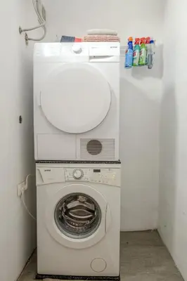 a white washer and dryer in a room at Central Castle View Apartment in Ljubljana
