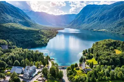 an aerial view of a lake in the mountains at Apartma Leila in Bohinj