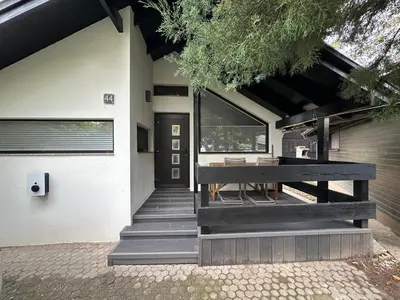 a house with a porch with a bench on it at Family Holiday Home in Terme Čatež in Čatež ob Savi