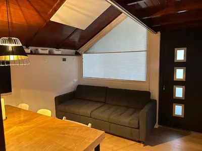 a living room with a couch and a table at Family Holiday Home in Terme Čatež in Čatež ob Savi