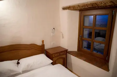 a bedroom with a bed and a window at Pri Bregarju in Podsabotin