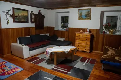 a living room with a couch and a coffee table at Sigma house in Mojstrana