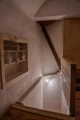 a staircase in a house with a window at Sigma house in Mojstrana