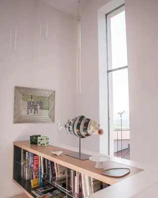 a room with a book shelf with a fish on it at Peaceful Stay Among the Vines in Vipolže