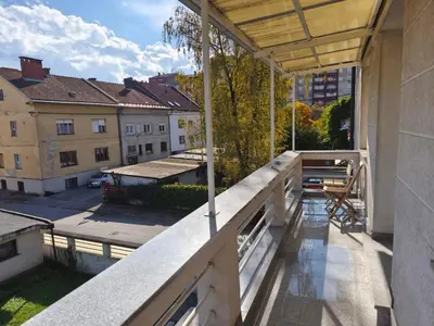 an apartment balcony with a view of a city at Villa Pinta Pika in Ljubljana