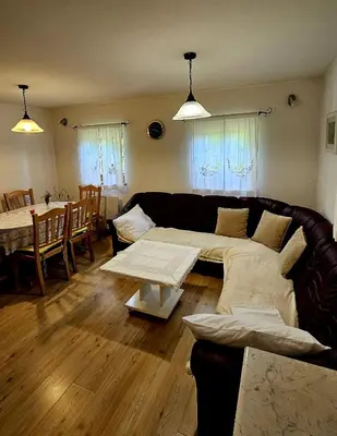 a living room with a couch and a table at Country House Srček in Bizeljsko