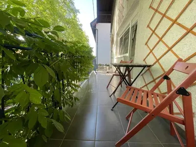 a bench on the balcony of a building at At the Burkulis' in Ljubljana