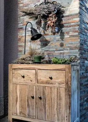 a wooden dresser with a lamp on top of it at Peaceful Heartwarming Home With A Green Terrace in Maribor