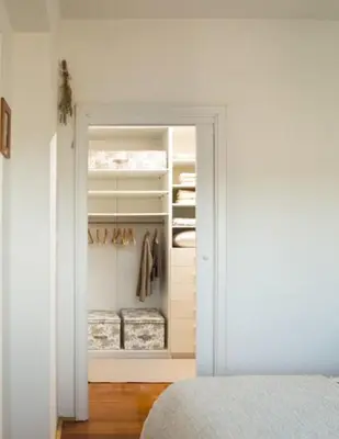 a bedroom with a door open to a closet at Peaceful Heartwarming Home With A Green Terrace in Maribor