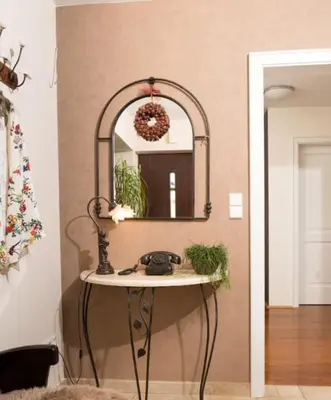a bathroom with a sink and a mirror on a wall at Peaceful Heartwarming Home With A Green Terrace in Maribor