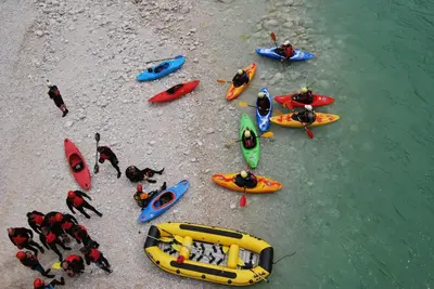a group of people in kayaks on the shore at Apartment House Cviter in Bovec