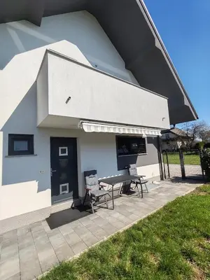 a building with a picnic table and a bench at Studio Hathor - Bikers Welcome in Kranj