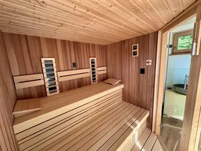a inside of a sauna with wood paneling at DESIREE with Sauna&HotTube at Potatoland Lux Resort in Šenčur