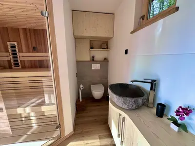 a bathroom with a sink and a tub at DESIREE with Sauna&HotTube at Potatoland Lux Resort in Šenčur