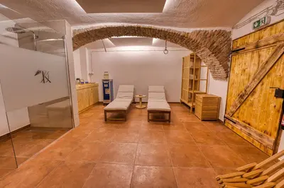 a room with benches in a room with a barn door at Domačija Kveder in Cerklje na Gorenjskem