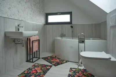 a bathroom with a sink and a tub and a toilet at Vila Vinita in Sveti Jurij ob Ščavnici