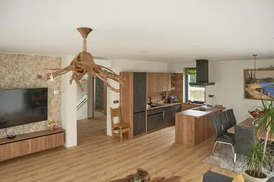 a living room with a kitchen and a living room with at Vila Vinita in Sveti Jurij ob Ščavnici