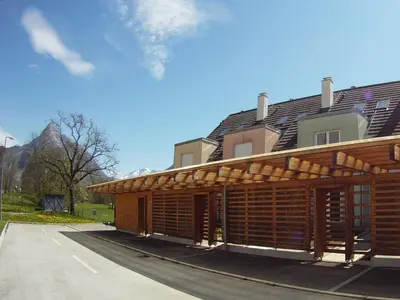 a building with awning on the side of a road at Apartment Wild Soca No 7 in Bovec