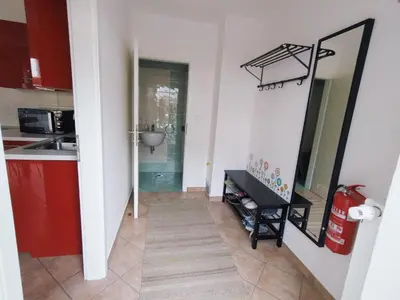 a hallway with a mirror and a sink in a kitchen at Apartment Wild Soca No 7 in Bovec