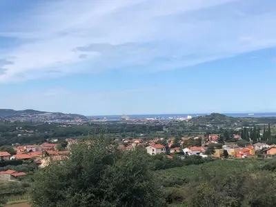 a view of a town from a hill at Apartment Lucija - Dekani in Dekani