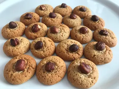 a white plate withocolate chip cookies on a plate at Old Parish House in Bled