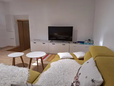 a living room with a couch and a flat screen tv at Šipk -FREE-PARKING-BREAKFAST-TERRACE in Vojnik