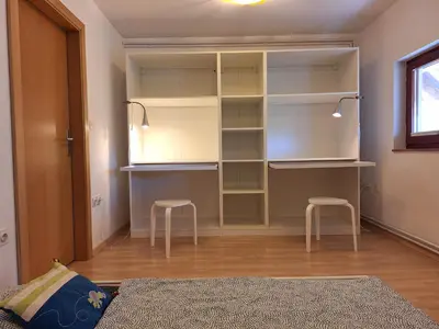 a bedroom with a closet with two stools in it at Šipk -FREE-PARKING-BREAKFAST-TERRACE in Vojnik