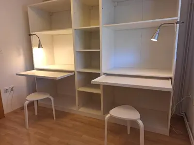 a closet with two stools and a lamp and shelves at Šipk -FREE-PARKING-BREAKFAST-TERRACE in Vojnik