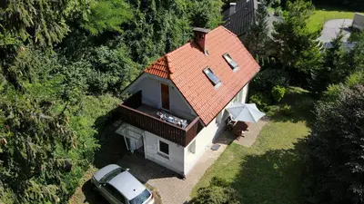 an overhead view of a house with a red roof at BledRoom in Bled
