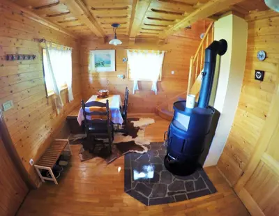 an overhead view of a dining room with a stove in a cabin at Lodge Bled in Bled