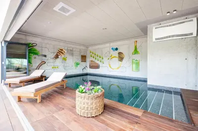a room with a glass pool in the middle of the room at Hiša Marija House in Miklavž pri Ormožu