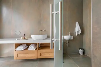a bathroom with a white sink and a shower at Hiša Marija House in Miklavž pri Ormožu