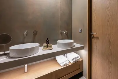 a bathroom with two sinks and a mirror at Hiša Marija House in Miklavž pri Ormožu