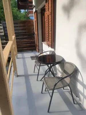 two chairs and a glass table on a balcony at Apartment with one room-LUCIA in Selo