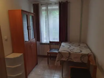 a room with a table and a chair and a window at Apartment with one room-LUCIA in Selo