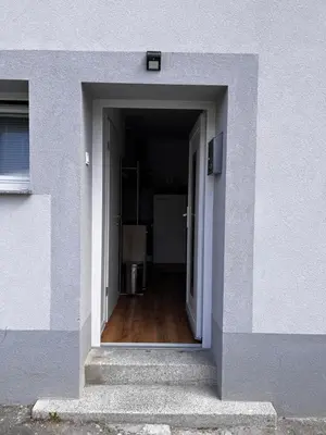 an open door into a hallway in a building at Apartmaji MAS 3 in Ljubljana