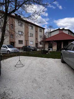 a metal object on the ground in front of a building at Apartmaji MAS 3 in Ljubljana