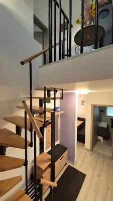 a staircase leading up to a loft conversion at Hiša Ispira in Moravske Toplice