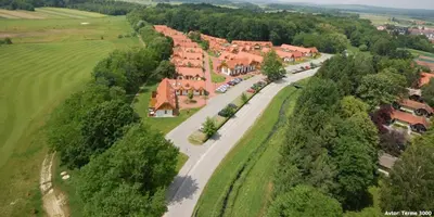 an aerial view of a village with houses and trees at Apartments Prekmurska vas - Vital Resort in Moravske Toplice