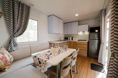 a small kitchen with a table in a room at Saxida Wine Estate in Zalošče