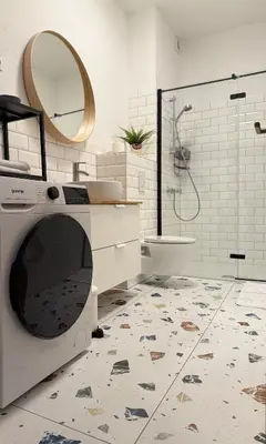 a bathroom with a toilet and a sink and a mirror at Aumetz Square Apartment 2 in Idrija