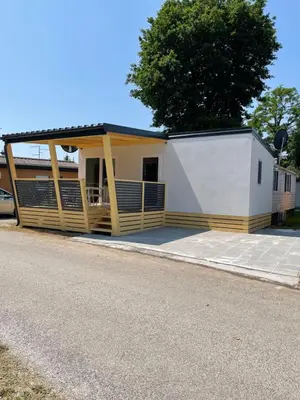a small building with a porch on the side of a road at Pavel 1 Cottage with 2 Thermal Riviera Tickets in Moravske Toplice