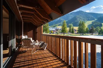 a balcony with a view of a lake and mountains at Gora Luxury Apartments in Kranjska Gora