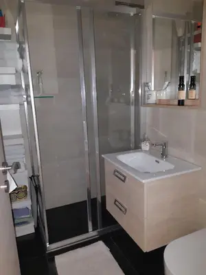 a bathroom with a sink and a shower at Apartma Misha in Bovec