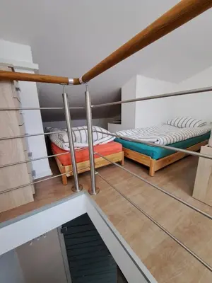 a room with two bunk beds on the stairs at Apartma Misha in Bovec