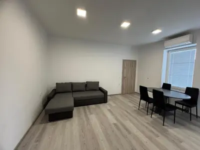 a living room with a couch and a table at Jack apartments in Maribor