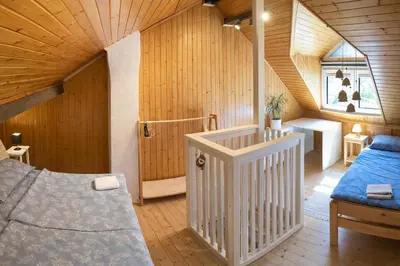 a bedroom with a bed and a wooden ceiling at Holiday Home Kristi in Bovec
