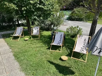 three lawn chairs are sitting in the grass at Kamp Tura- camping pitch only in Vipava