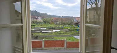 an open window with a view of a yard at Apartment Econte near old town in Ljubljana